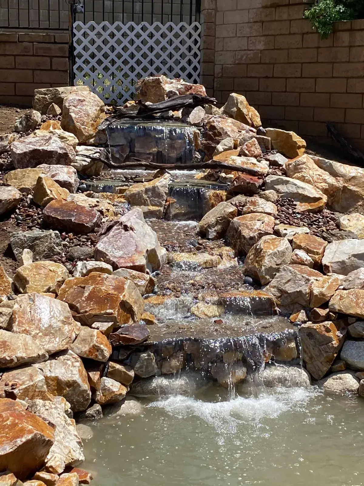 8 by 16 foot koi pond with stone waterfall in Glendora, CA